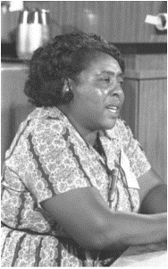 Fannie Lou Hamer, seated, giving an interview